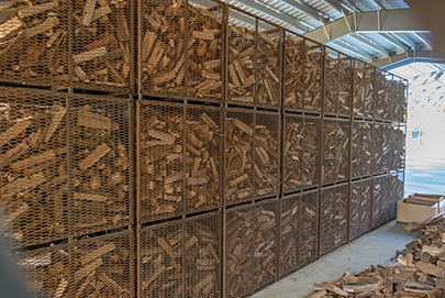 kiln dried firewood in bins indoors small DSC 1380
